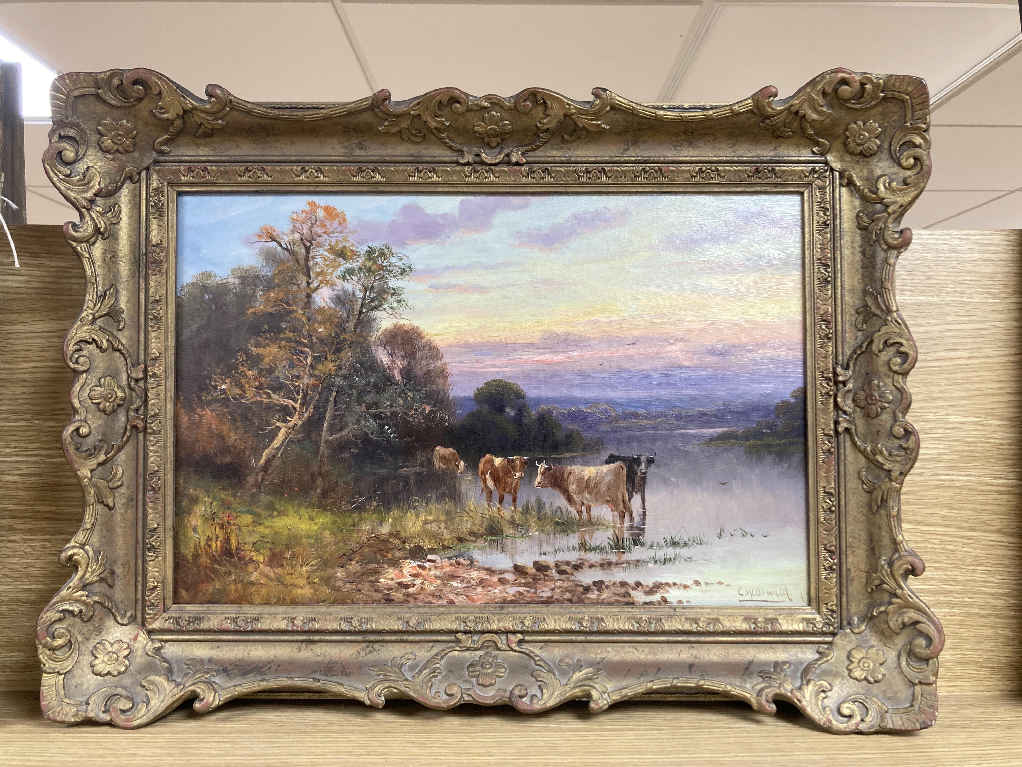 Charles W. Oswald (fl.1892-1900), oil on canvas, Cattle watering at sunset, signed and dated 1910, 29 x 44cm